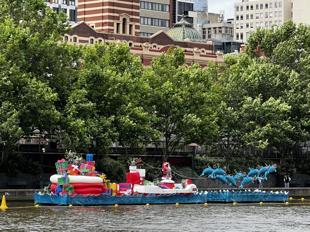 Santa in Australia with Dolphins.